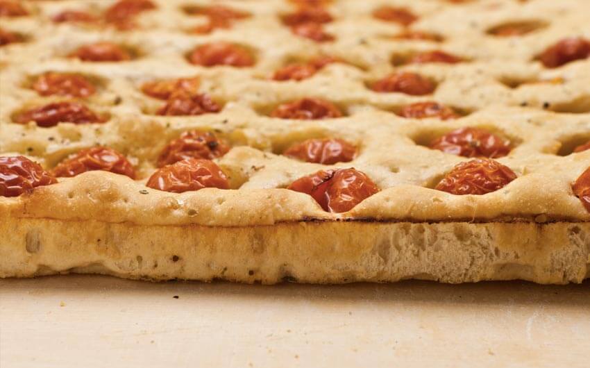 Genovese focaccia bread with cherry tomatoes